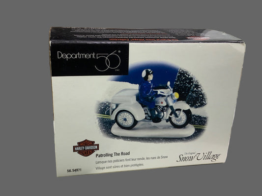 Harley-Davidson Snow Village figurine packaging on a gray background