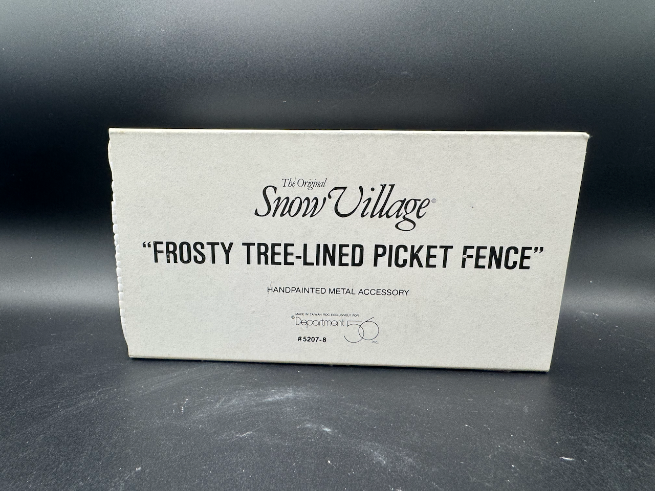 Frosty Tree-Lined Picket Fence
