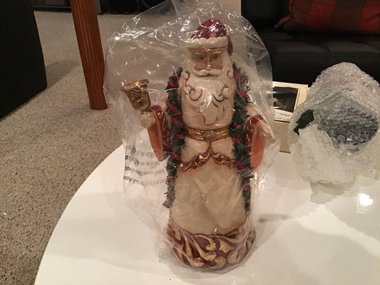 Ringing In The Season. Ivory And Gold Santa With Bell